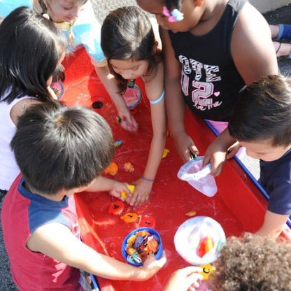 Constructive Playthings Indoor/Outdoor Sand and Water Activity Table for Kids Ages 1-3, Classroom Play Table with Dry-Erase Top and 2 Side Trays, Blue/Red, 18" H
