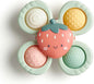 Itzy Ritzy Pop & Whirl – Fidget Spinner Travel & Bath Toy for Babies & Toddlers – Fidget w/Textured Silicone Popper to Develop Fine Motor Skills –Sticks to Highchairs, Tables, Tubs, More (Strawberry)