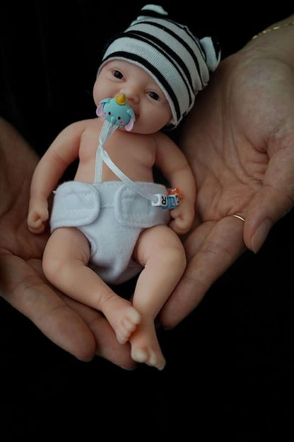 Reborn Baby Doll ，7 Inch Silicone Doll Girl ，Mini Realistic Newborn Baby Dolls Silicone Full Body Stress Relief with Feeding Accessories