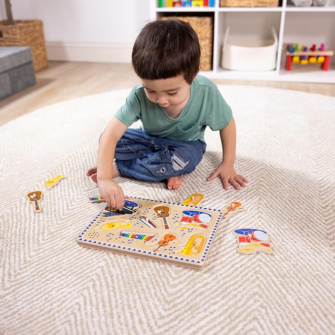 Melissa & Doug Musical Instruments Sound Puzzle - Wooden Peg Puzzle with Light-Activated Sound Effects (8 pcs) Wooden Peg Baby Music Learning Toys, for Toddlers and Preschoolers Ages 2+